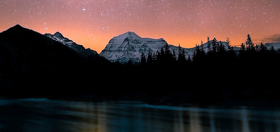 Mt Robson viewed at night underneath a starry sky