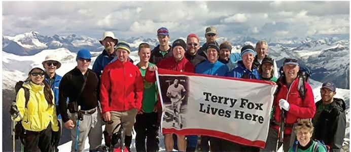 Group of hikers posing on top of Mt Terry Fox