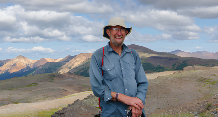 Dave standing in front of the Rainbow Range.