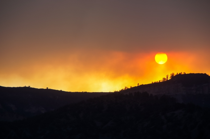 Image of smokey sky with orange sun
